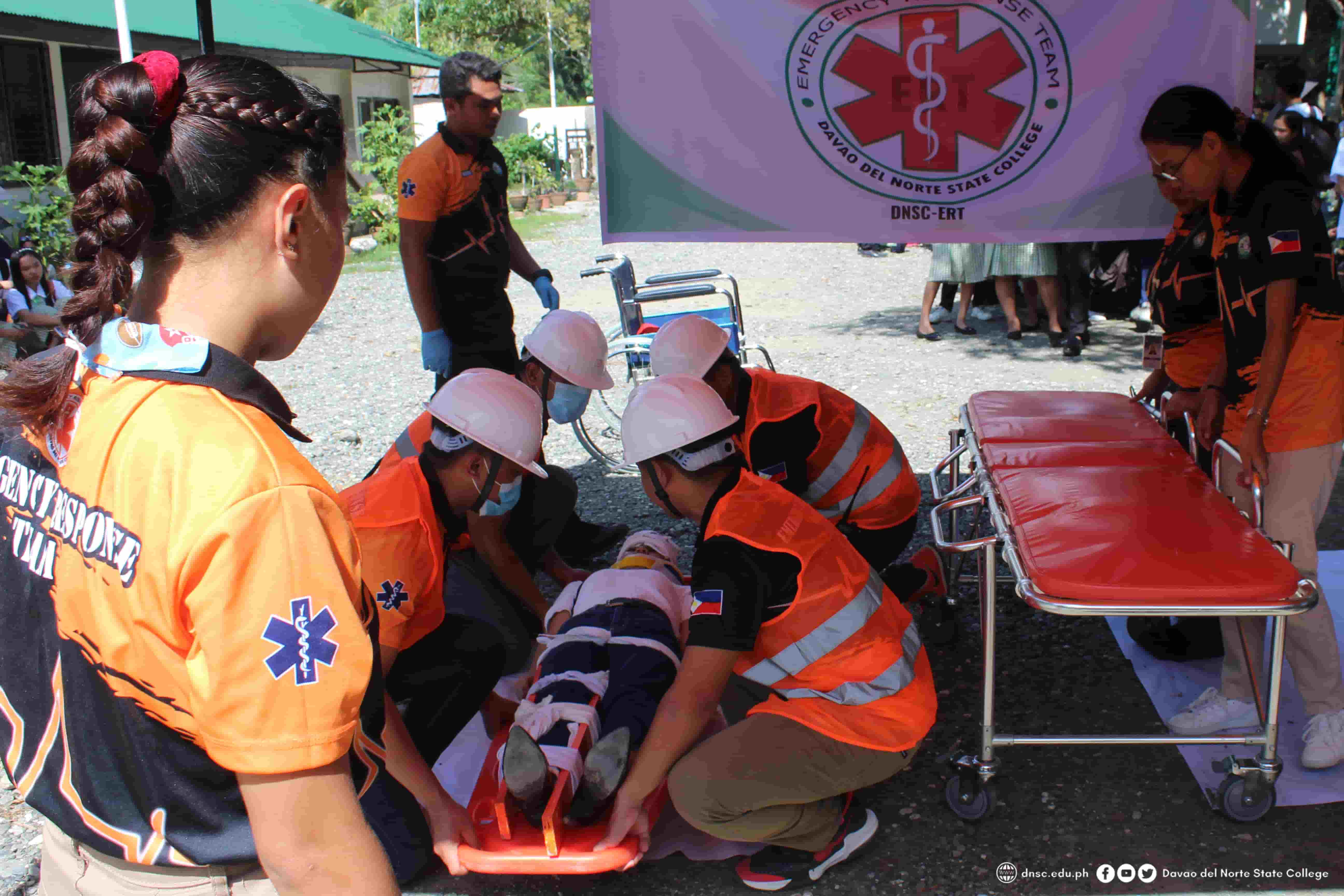 DRM Students rescuing an injured person during the earthquake