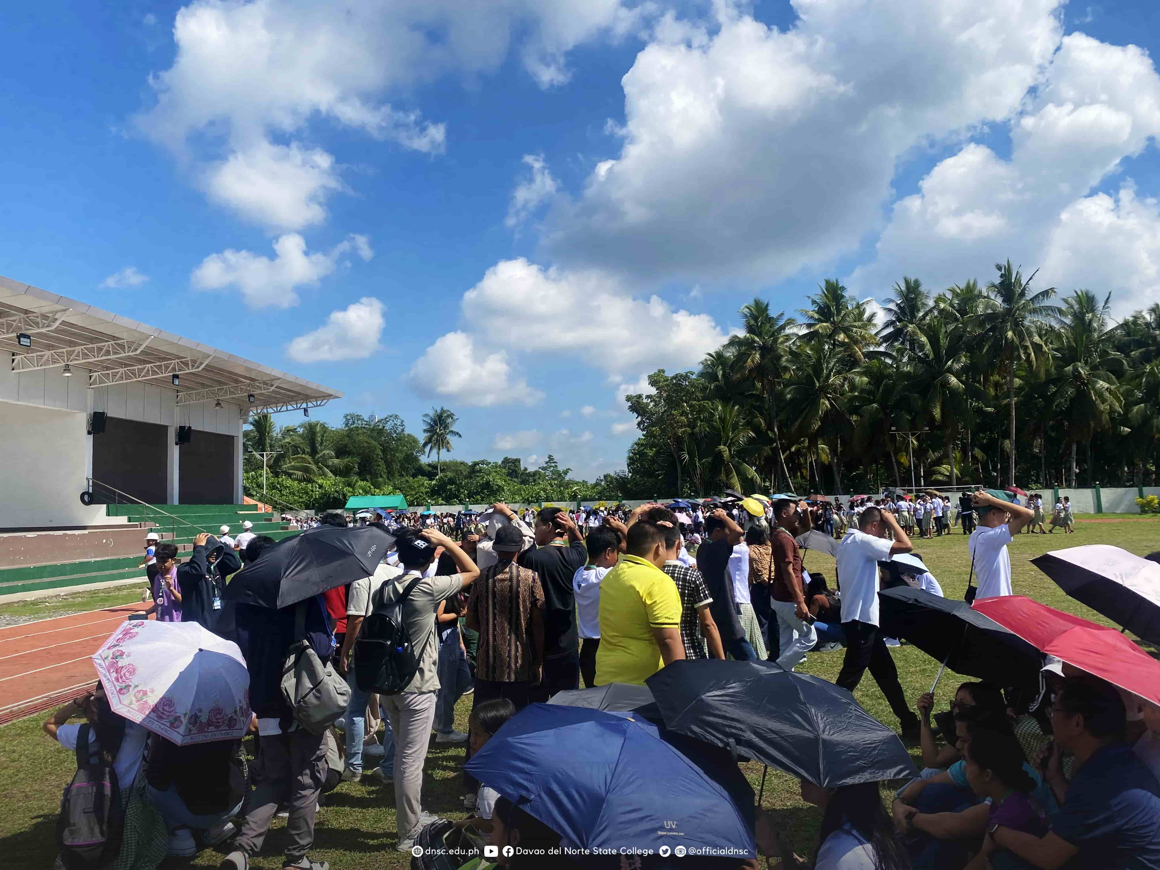 Students evacuating to an open area as part of the earthquake drill. Photo by Randy Magayon, DNSC PIO.